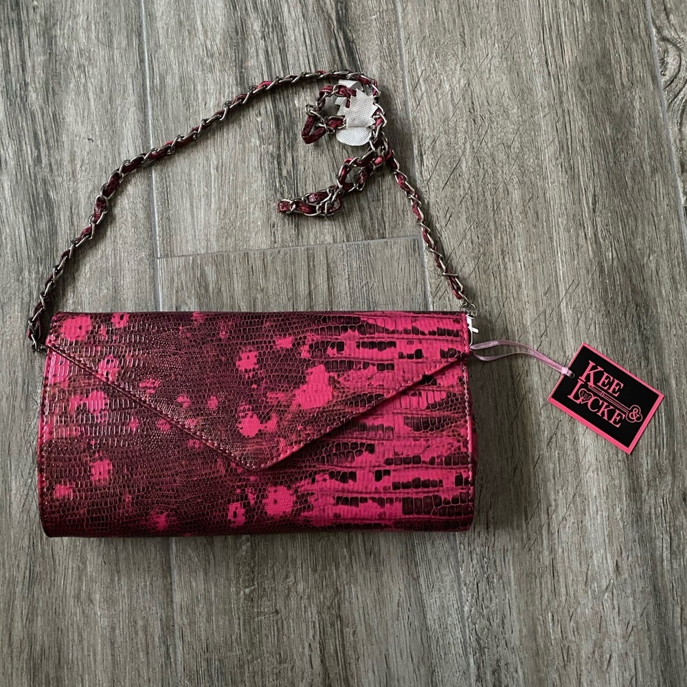 NWT clutch with strap.